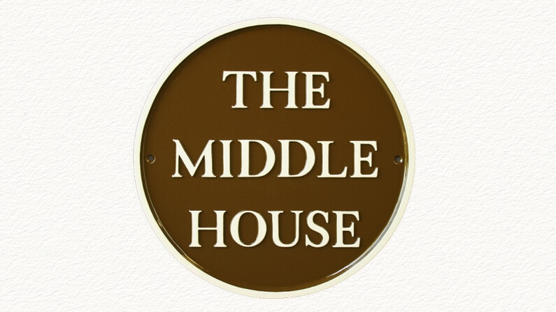 Large round house plaque in brown and magnolia