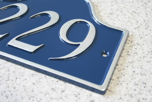 Sculptured metal house sign finished in black and gold