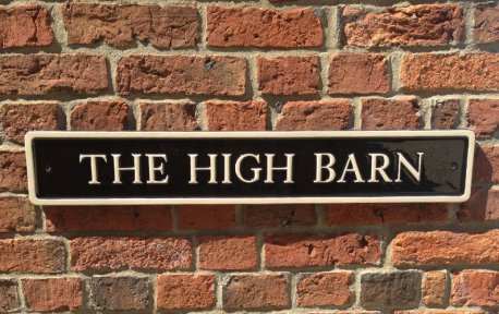 cast aluminium barn sign in black and gold