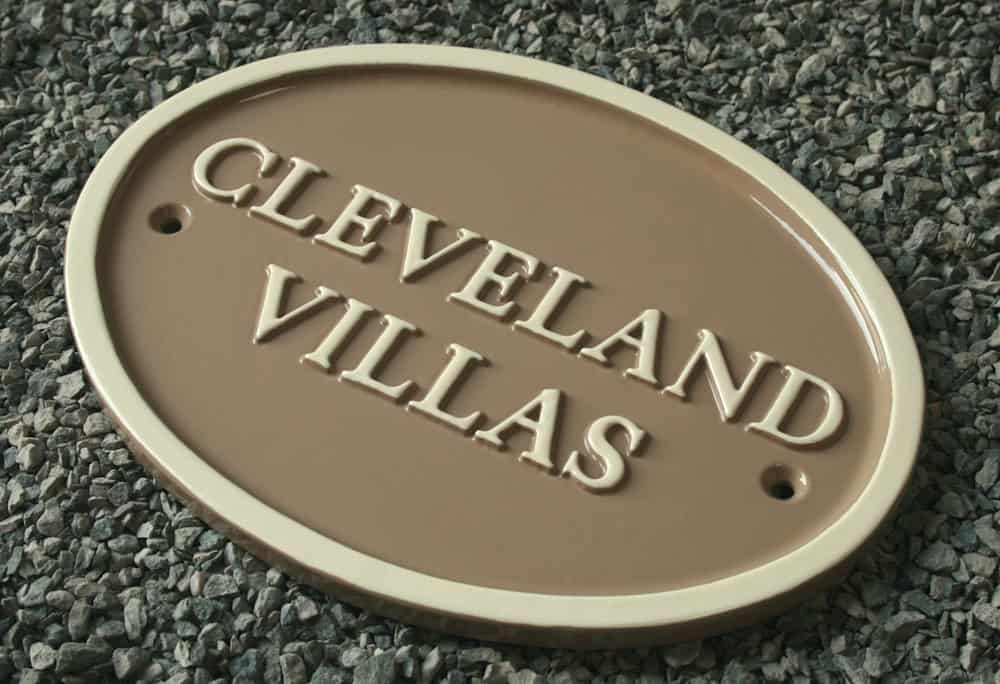 small oval handmade house sign