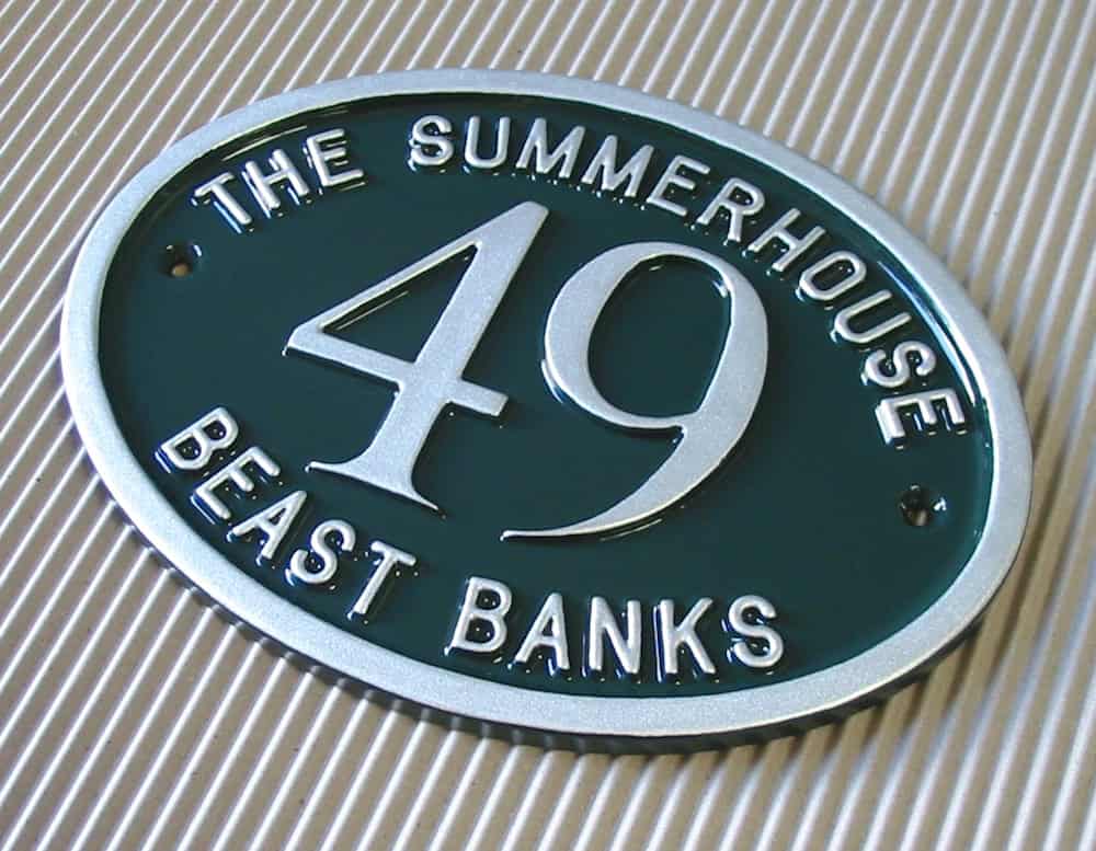 House name sign finished in British Racing green with silver text