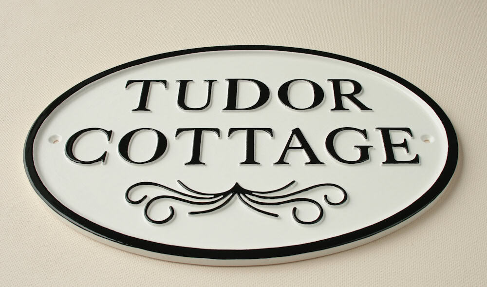 white & black vintage looking house sign